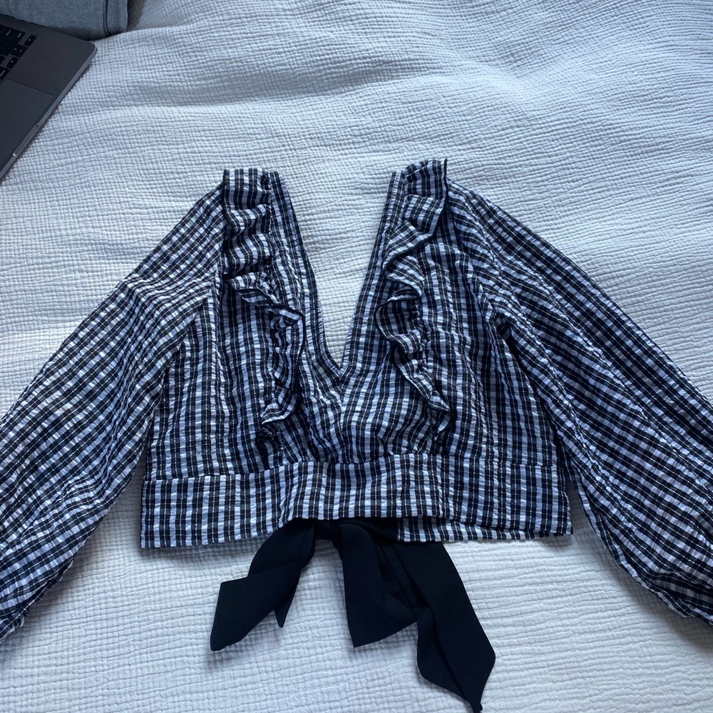 Top shop backless shirt with bows in the back.